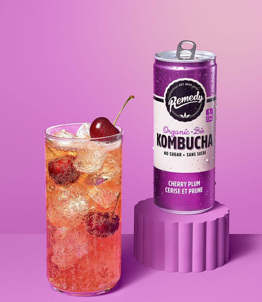 Remedy Kombucha Cherry Plum can with glass