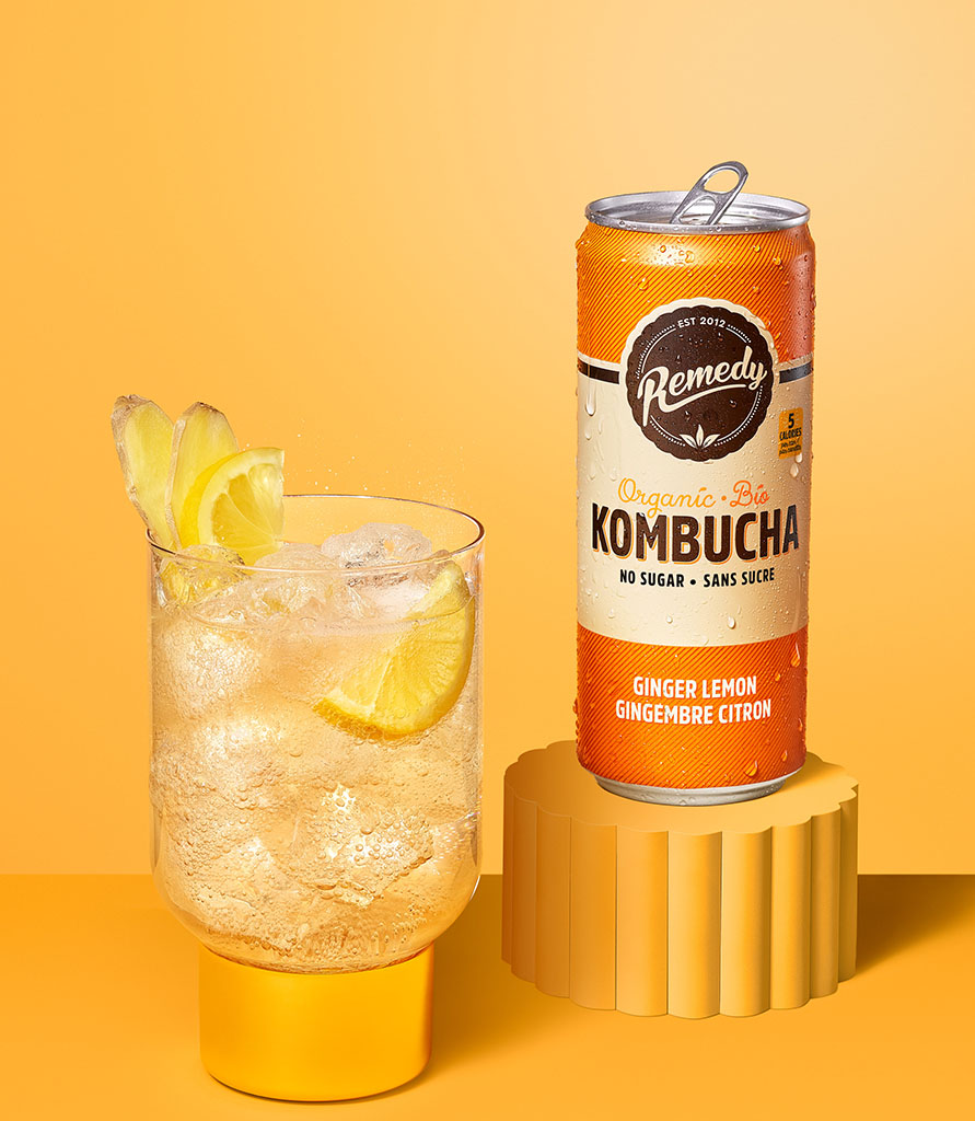 Remedy Kombucha Ginger Lemon can with glass