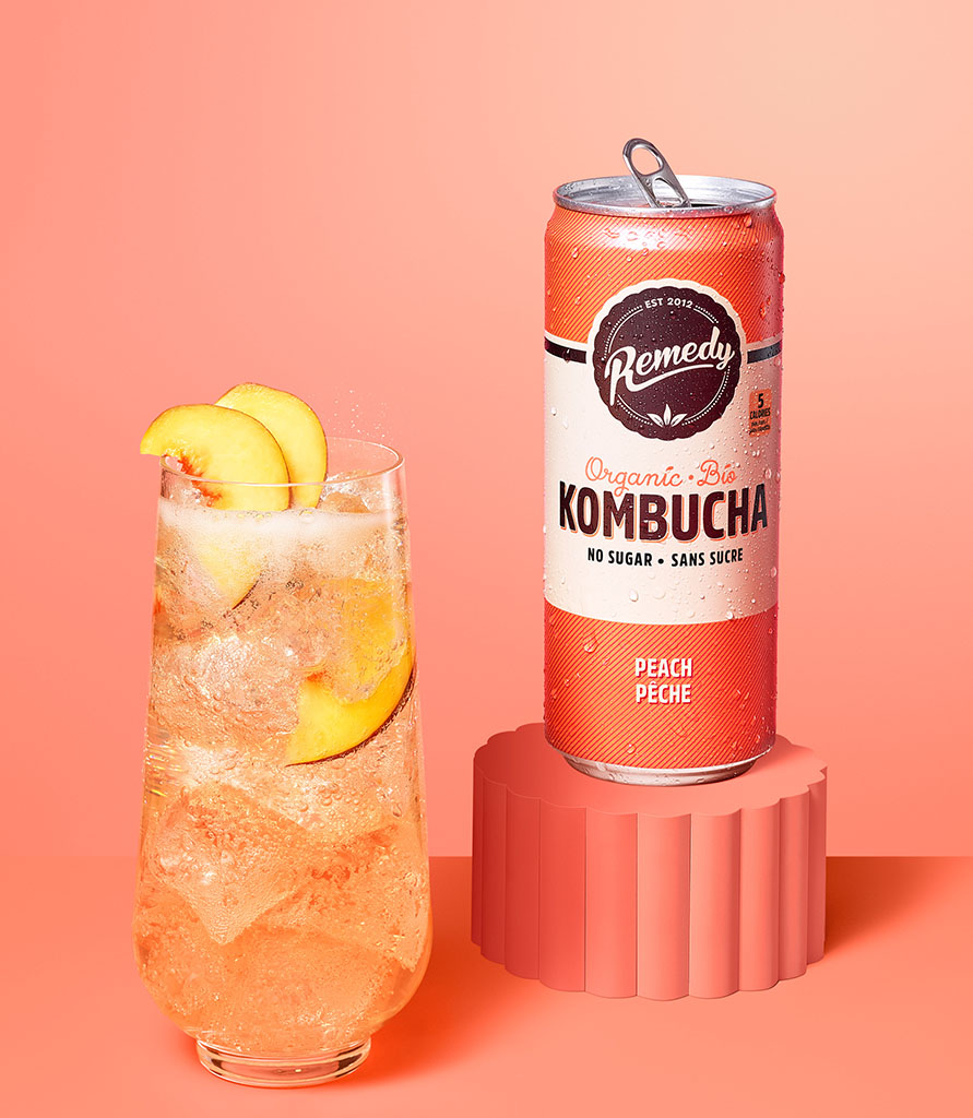 Remedy Kombucha Peach can with glass