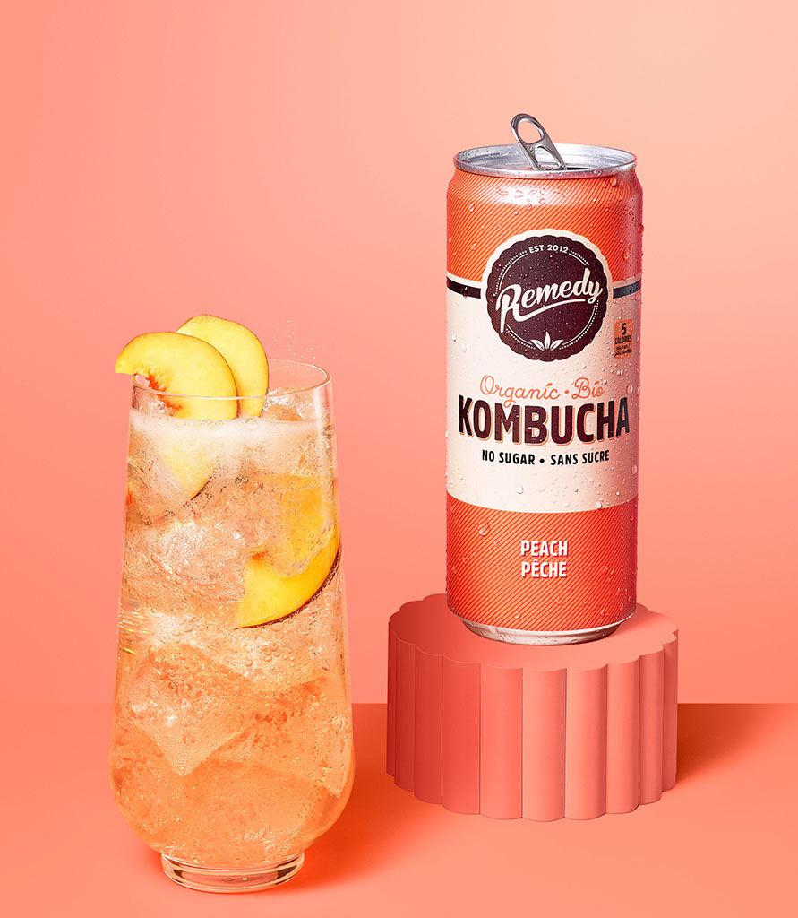 Remedy Kombucha Peach can with glass 